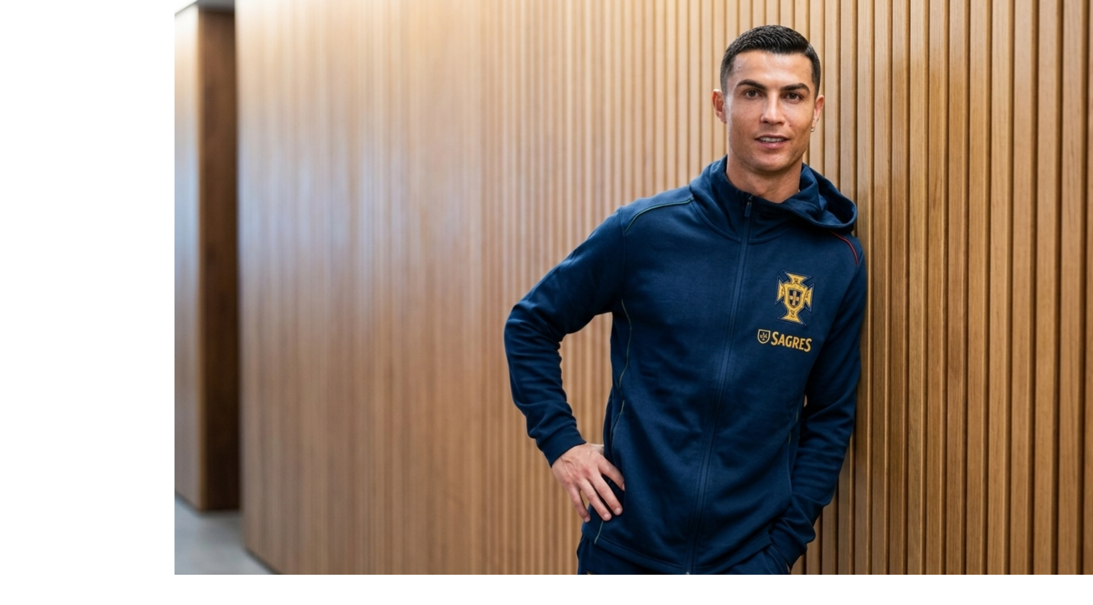 Cristiano Ronaldo wearing the Portugal Media Conference navy full-zip hoodie with Portugal crest and gold sponsor branding.