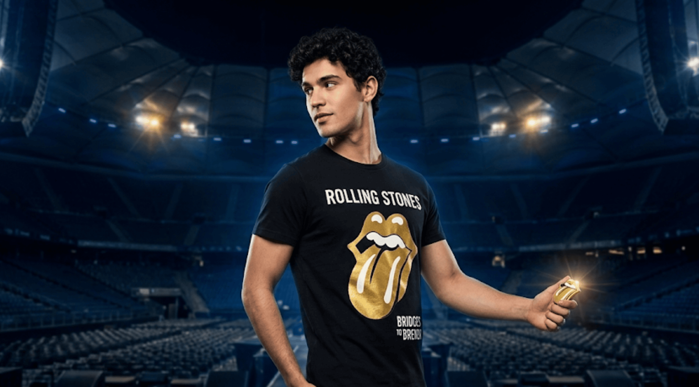 The Rolling Stones Foreign Tongues black T-shirt featuring the metallic gold and yellow chrome 3D hot lips logo with vintage white typography.
